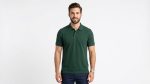 Man wearing a premium men's forest green polo shirt featuring a small embroidered tree logo on the chest