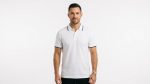 Man wearing premium men's white polo shirt with navy blue tipped collar and cuffs
