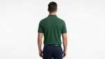 Man wearing a premium men's forest green polo shirt featuring a small embroidered tree logo on the chest