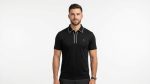 Man wearing a premium men's obsidian black polo shirt with a silver tipped collar and an embroidered A logo on the chest